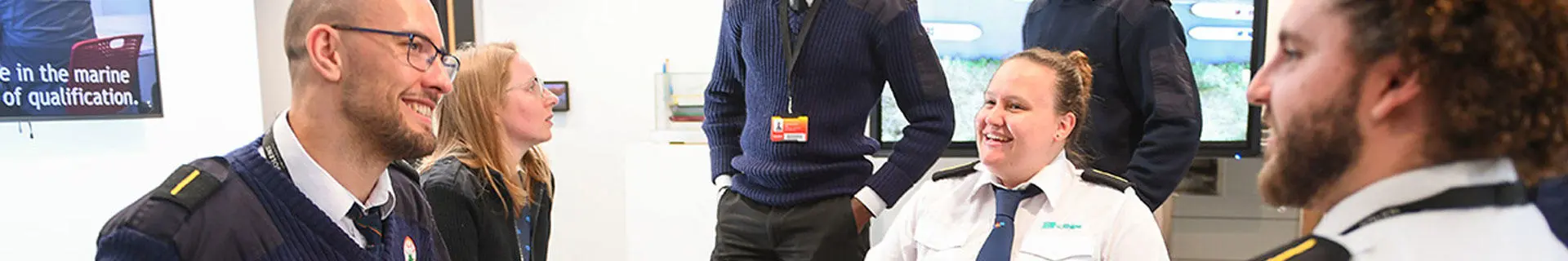 A male deck cadet with a female lecturer in the classroom