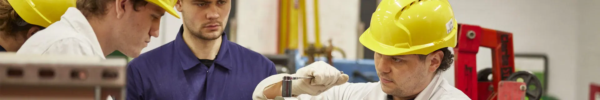 An engineer cadet at one of the workstations in the engineering workshops