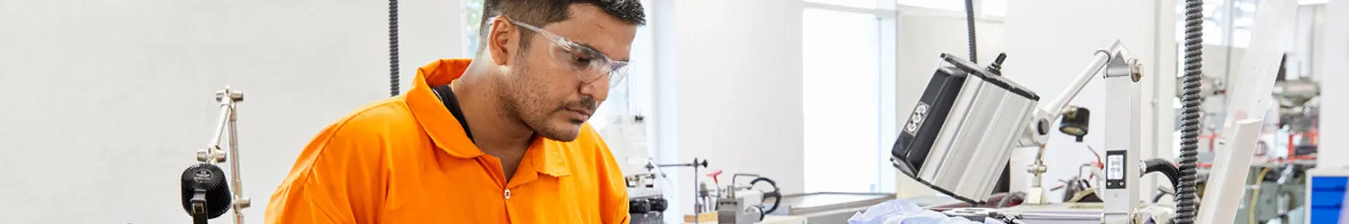 An engineer officer of the watch student undertaking workshop skills training in the engineering workshops