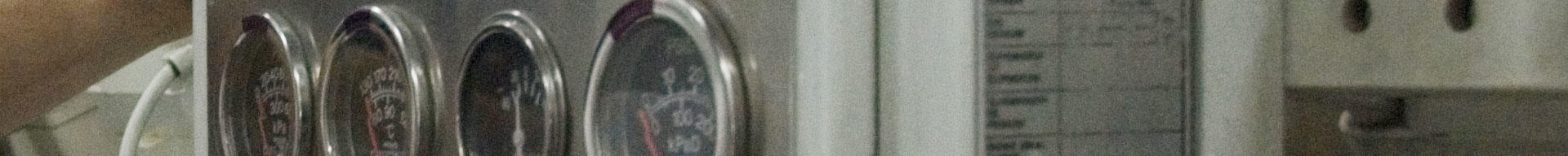 Close-up of dials and equipment in a superyacht engine room