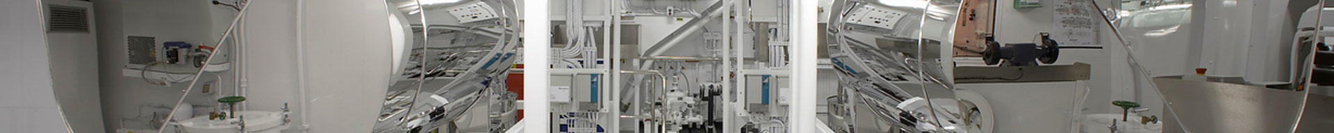 A wide shot of a very clean superyacht engine room