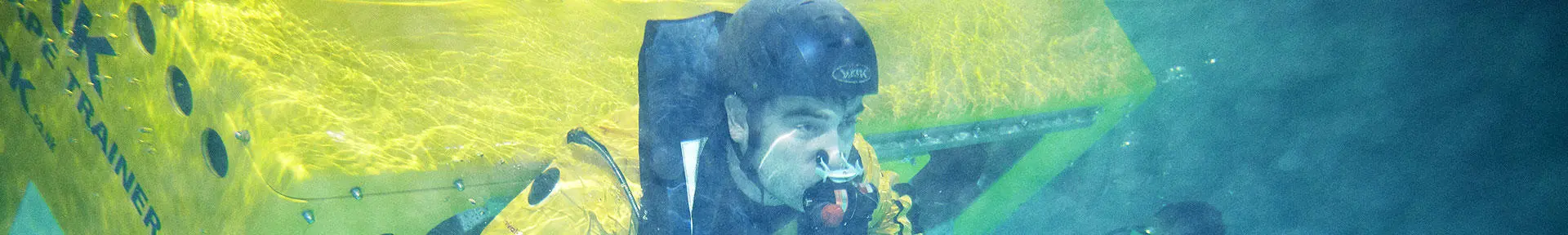 Underwater shot of a student exiting the HUET trainer