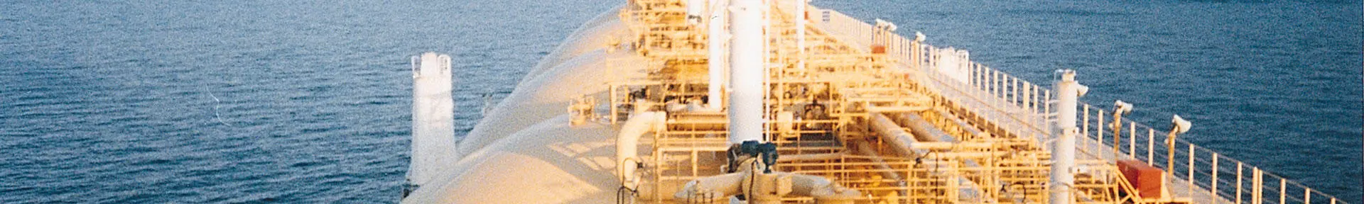 An orange gas tanker at sea