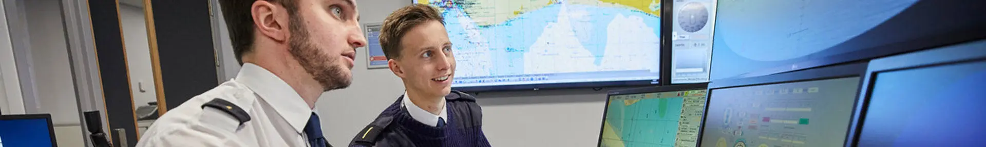 Two deck cadets using the ECDIS simulator