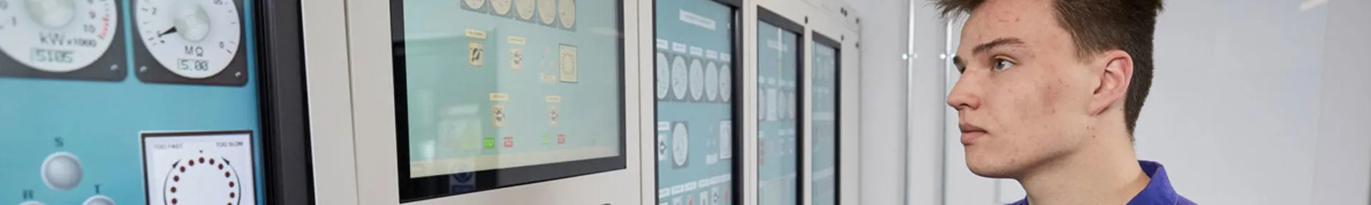 Engineer using the touch screen controls in the engine room simulator