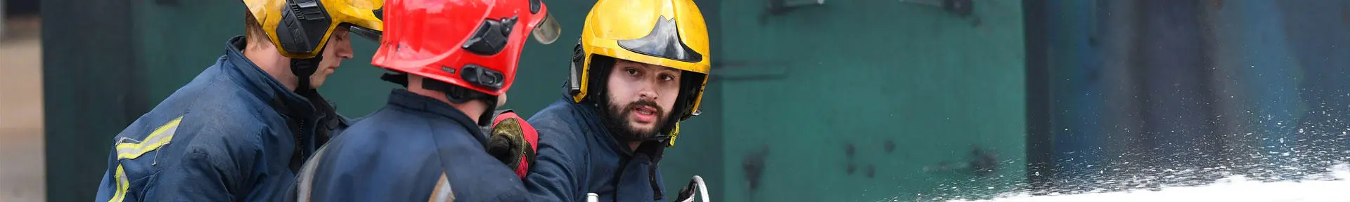 Fire fighting students under instruction at the fire ground at the Warsash campus