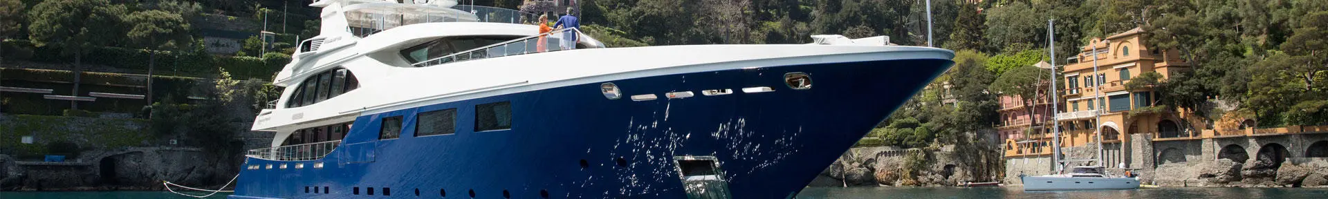 A superyacht at anchor in a bay