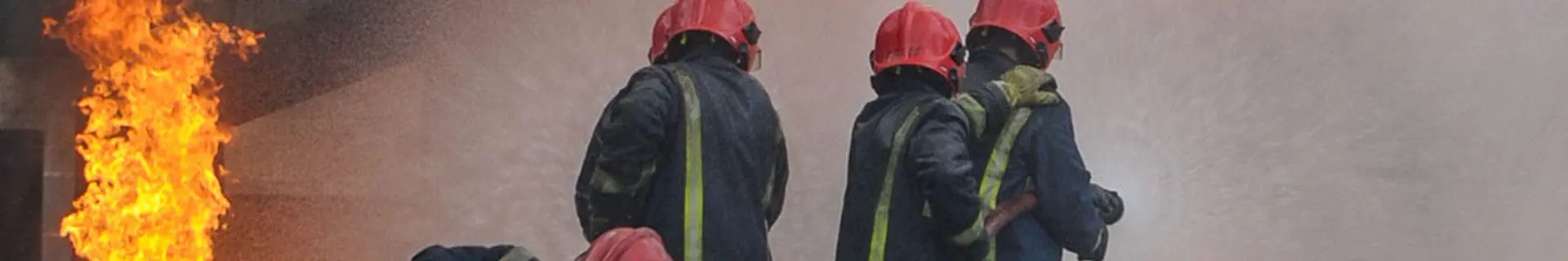 Fire fighters putting out a fire