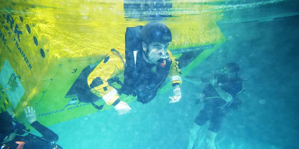 Student escaping from a capsized vessel