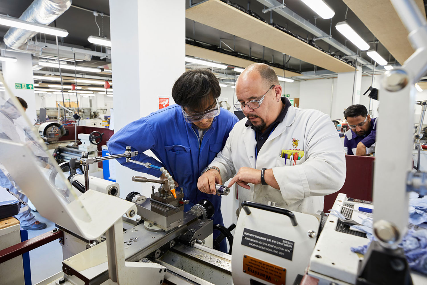 Eningeering cadet and lecturer in the Marine Engineering Workshop