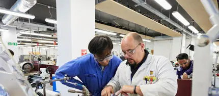 Eningeering cadet and lecturer in the Marine Engineering Workshop