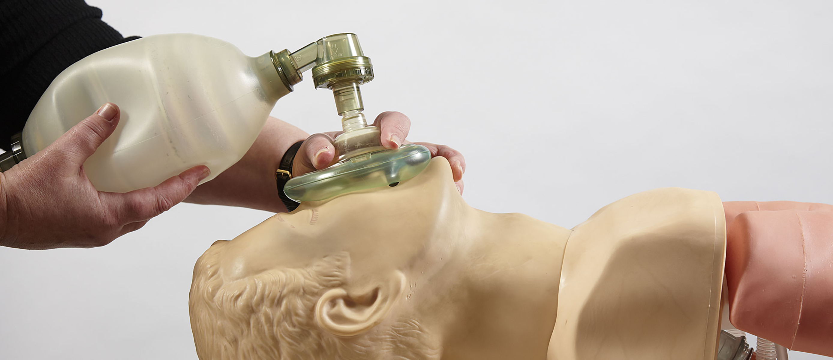 A cadet practicing CPR on a dummy in the medical training centre