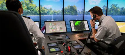 Cadets in the bridge simulator using the controls