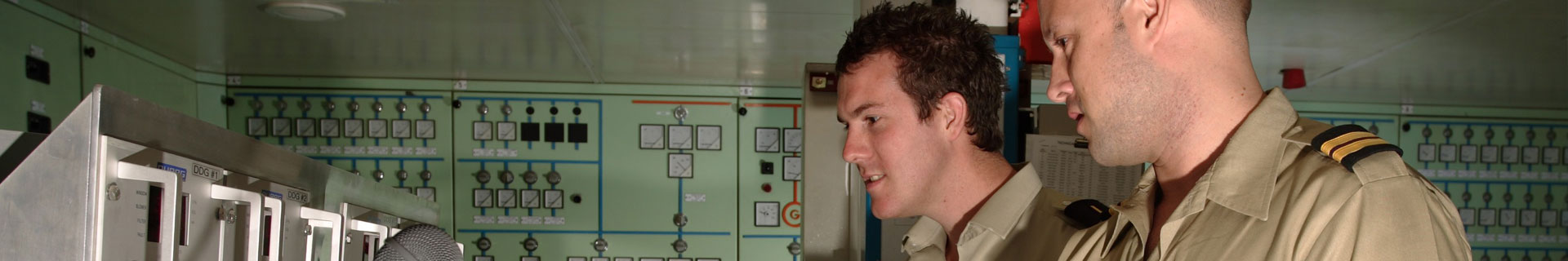 Two engineer officers in the control room of a Carnival cruise ship