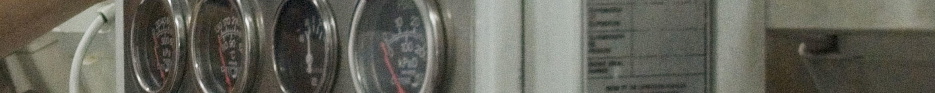 Close-up of dials and equipment in a superyacht engine room