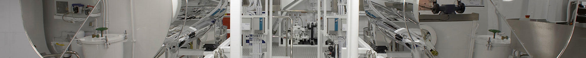 A wide shot of a very clean superyacht engine room