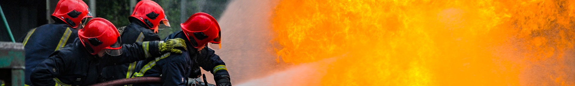 A group of fire fighters putting out a large fire at the training ground at Warsash