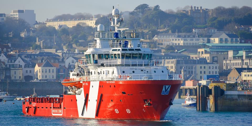 A survey vessel leaving port