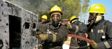 Cadets training at the fire school in full gear