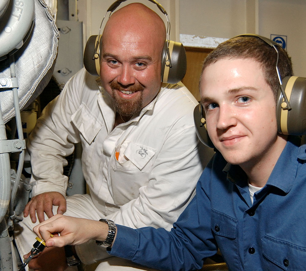 A junior RFA engineer with a senior engineer officer in the engine room